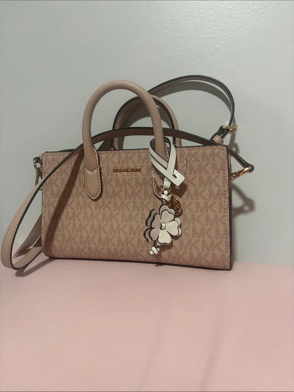 A cute MICHAEL KORS Blush Pink Logo Satchel with Floral Charm